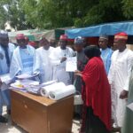 Chairman-of-Gwale-Local-Government-Hon.-Abubakar-Muazu-Mojo-presenting-certificate-of-employment-to-one-of-the-beneficiaries