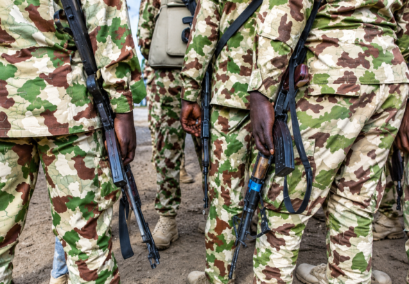 Camouflaged Soldiers with Rifles