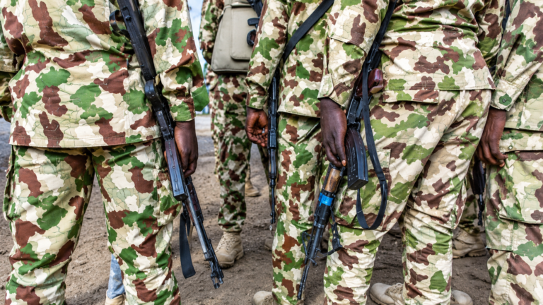 Camouflaged Soldiers with Rifles